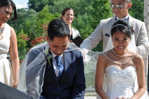 Veil, cord and coin ceremony at a beautiful, summer ceremony at the Evergreen Brickworks